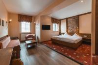 Ein Bett oder Betten in einem Zimmer der Unterkunft AKZENT Hotel Berg's Alte Bauernschänke- Wellness und Wein