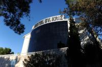a building with a sign on top of it at Hotel Sveti Kriz in Trogir