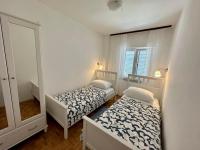 Postel nebo postele na pokoji v ubytování Apartments Simona