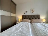 Posteľ alebo postele v izbe v ubytovaní Apartment Sara