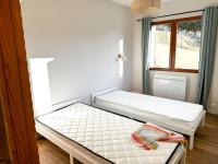 Ein Bett oder Betten in einem Zimmer der Unterkunft Le Plaisance, Beuil Les Launes