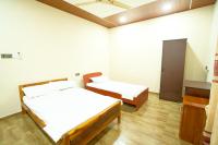 CatRay Inn - Batticaloaにあるベッド