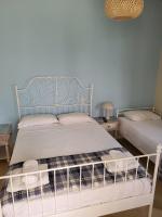 Postel nebo postele na pokoji v ubytování Margarita rooms