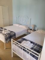 Postel nebo postele na pokoji v ubytování Margarita rooms