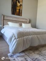 Postel nebo postele na pokoji v ubytování Hotel apartment aeon tower