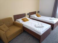 Łóżko lub łóżka w pokoju w obiekcie Hotel Eminent