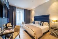 Postel nebo postele na pokoji v ubytování Abba San Sebastián Hotel