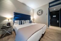 Postel nebo postele na pokoji v ubytování Abba San Sebastián Hotel