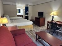a hotel room with two beds and a desk at Holiday Inn Express Hotel & Suites San Dimas by IHG in San Dimas