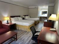 a hotel room with two beds and a couch at Holiday Inn Express Hotel & Suites San Dimas by IHG in San Dimas
