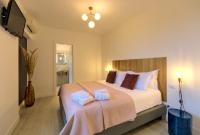 A bed or beds in a room at Villa Morro Suites