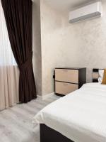 Postel nebo postele na pokoji v ubytování Premium Suites