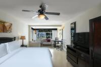 a bedroom with a bed and a ceiling fan at Hidden Beach Resort Au Naturel Adults Only Catamarán, Cenote & More Inclusive in Akumal