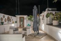 Patio alebo iná vonkajšia časť ubytovania Dimora Asmara 11 15