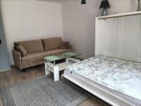 Posteľ alebo postele v izbe v ubytovaní Apartament Blekit Nieba