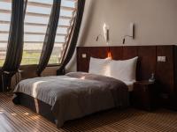 Łóżko lub łóżka w pokoju w obiekcie Hotel Monopol