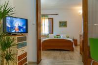 TV a/nebo společenská místnost v ubytování City Center ANA Apartments