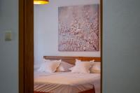 Postel nebo postele na pokoji v ubytování City Center ANA Apartments