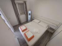 Postel nebo postele na pokoji v ubytování Vinko Apartment