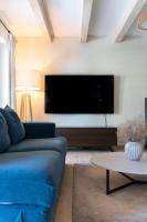 Televízia a/alebo spoločenská miestnosť v ubytovaní Villa Cavallina