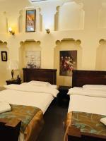 Ein Bett oder Betten in einem Zimmer der Unterkunft Heritage Home Guest House