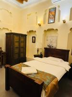 Ein Bett oder Betten in einem Zimmer der Unterkunft Heritage Home Guest House