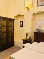 Ein Bett oder Betten in einem Zimmer der Unterkunft Heritage Home Guest House