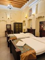 Ein Bett oder Betten in einem Zimmer der Unterkunft Heritage Home Guest House