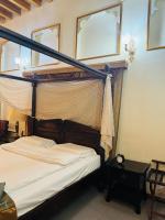 Ein Bett oder Betten in einem Zimmer der Unterkunft Heritage Home Guest House