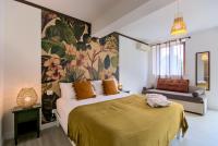 A bed or beds in a room at Villa Morro Suites