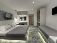 Posteľ alebo postele v izbe v ubytovaní Aphrodite Hotel & Apartments