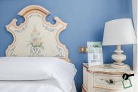 HOTIDAY Room Collection - Venezia Santa Luciaにあるベッド