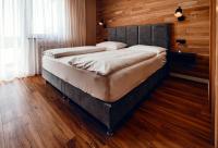 A bed or beds in a room at Pension Baumgartner-Berghof