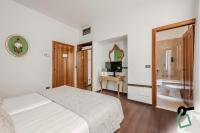 HOTIDAY Room Collection - Venezia Santa Luciaにあるベッド