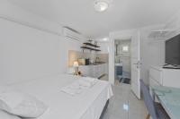 Łóżko lub łóżka w pokoju w obiekcie Apartments Petrina