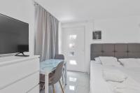 Telewizja i/lub zestaw kina domowego w obiekcie Apartments Petrina