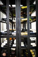 a bunch of wine bottles in a wine cellar at PM & Vänner Hotel in Växjö