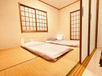 Memories-Inn最大四個独立房13人可入住にあるベッド