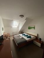 Postel nebo postele na pokoji v ubytování Pivovarský Hotel