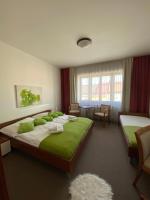 Postel nebo postele na pokoji v ubytování Pivovarský Hotel