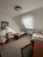 Postel nebo postele na pokoji v ubytování Pivovarský Hotel