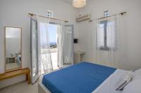 Postel nebo postele na pokoji v ubytování Aster house Agios Sostis