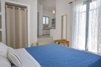 Postel nebo postele na pokoji v ubytování Aster house Agios Sostis