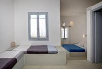 Postel nebo postele na pokoji v ubytování Aster house Agios Sostis