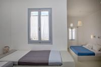 Postel nebo postele na pokoji v ubytování Aster house Agios Sostis