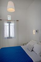 Postel nebo postele na pokoji v ubytování Aster house Agios Sostis