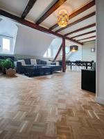 Część wypoczynkowa w obiekcie Appartement Le Baroque en duplex