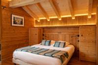 Posteľ alebo postele v izbe v ubytovaní Le Grand V, chalet de luxe avec piscine intérieure