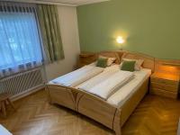 Łóżko lub łóżka w pokoju w obiekcie Sixtl, Landhaus