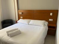 Postel nebo postele na pokoji v ubytování Hotel Venezuela